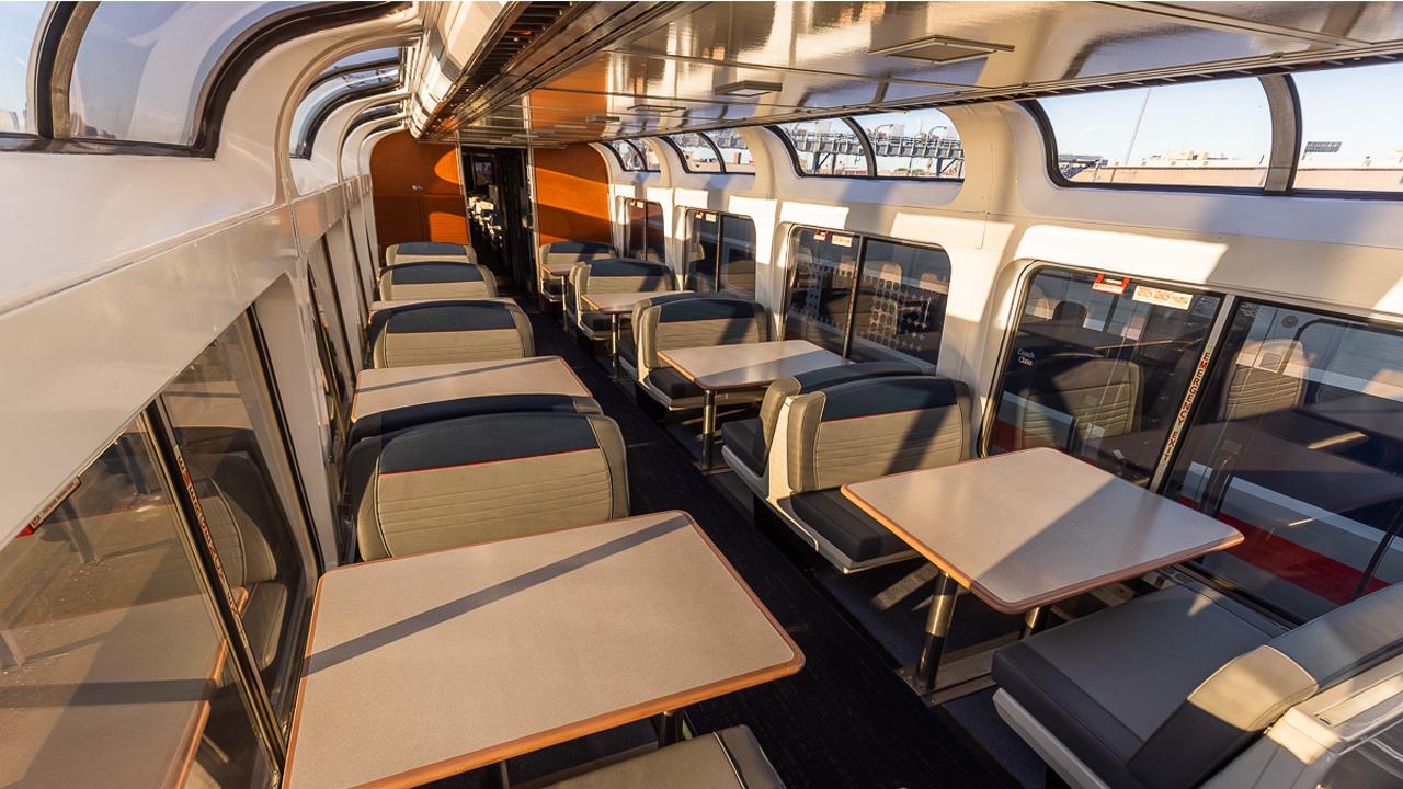As part of a $28 million railcar modernization program, Amtrak is refreshing its Superliner fleet with new seating cushions and upholstery, tables, curtains, and more. (Pictured: Superliner Lounge)