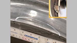 A wheel with an internal crack detected by ACWDS before the wheel was removed from the FAST train.  The inset photo is an example of a broken wheel that could be the result of such a defect.