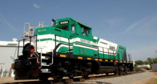 The Federal Railroad Administration-compliant battery-electric unit (pictured) that OmniTrax subsidiary NSR purchased from AMPS Traction offers 1,700 gross horsepower and 80,000 pound tractive effort.