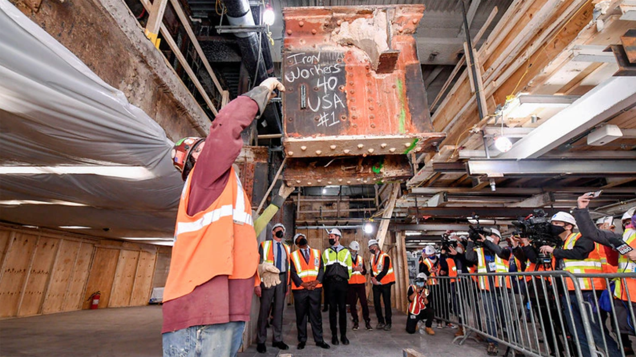MTA is advancing Penn Station reconstruction with the removal of seven low-hanging beams, dubbed “Head Knockers.” The beams, weighing in at 10 tons apiece, are part of the original Penn Station structure and have limited passageway heights to 6 feet, 8 inches.