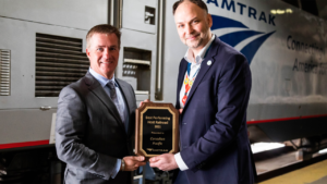 Amtrak President and CEO Stephen J. Gardner (right) recognized CP President and CEO Keith Creel with an award for earning an “A” on the Amtrak 2021 Host Railroad Report Card, which ranks Class I railroads for keeping its trains on time. The two are pictured at Amtrak Chicago Union Station.