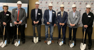 Lineage Logistics, JBS USA and OmniTRAX have teamed on a new cold-storage facility project in Windsor, Colo. OmniTRAX will be designing, building and operating “a custom intermodal rail solution” for the facility, which is slated to open in 2023. (Among the officials pictured is OmniTRAX CEO Dean Piacente, third from right.)