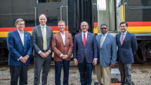 Among the officials participating in the Baton Rouge-New Orleans passenger rail inspection trip were (pictured left to right): Kansas City Southern President and CEO Pat Ottensmeyer, who supplied the train; Amtrak President and CEO Stephen Gardner; Canadian Pacific President and CEO Keith Creel; Louisiana Gov. John Bel Edwards; Louisiana Department of Transportation and Development Secretary Shawn D. Wilson; and FRA Administrator Amit Bose. (Amtrak Photo by Tom Davidenko)
