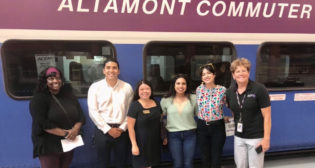 The San Joaquin Regional Rail Commission’s (SJRRC) ACE Rail Maintenance Facility will house the future Rail Academy of Central California (TRACC), which is seeking 70 students for instruction and hands-on-training this fall. Pictured: SJRRC TRACC Lead Tamika Smith (far left); San Joaquin Council of Governments Executive Director Diane Nguyen (third from left); and SJRRC Executive Director Stacey Mortensen (far right).