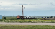 Pictured: The first of 11 CN trains hauling wind turbine units to Oyen, Alberta. (Photograph Courtesy of CN)