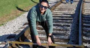Desiree Miller of Atlantic Railways uses a track gauge to take measurements during a University of Tennessee rail inspection and safety course. Miller received a Doug Golden Scholarship through the ASLRRA Short Line Education Fund to help pay for her training.