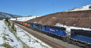 MRL helper locomotives assist at the rear end of a BNSF grain train climbing Bozeman Pass, west of Livingston, Mont. (Photo and caption by Bruce Kelly)