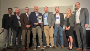 The Belt Railway Company of Chicago was one of five ASLRRA Central Region members to earn President’s Awards in 2022. Pictured: Belt Railway representatives accepted their award from ASLRRA Board Chair Stefan Loeb (far left), Central Region Vice President Kristin Bevil and ASLRRA President Chuck Baker (far right). (Photograph Courtesy of ASLRRA)