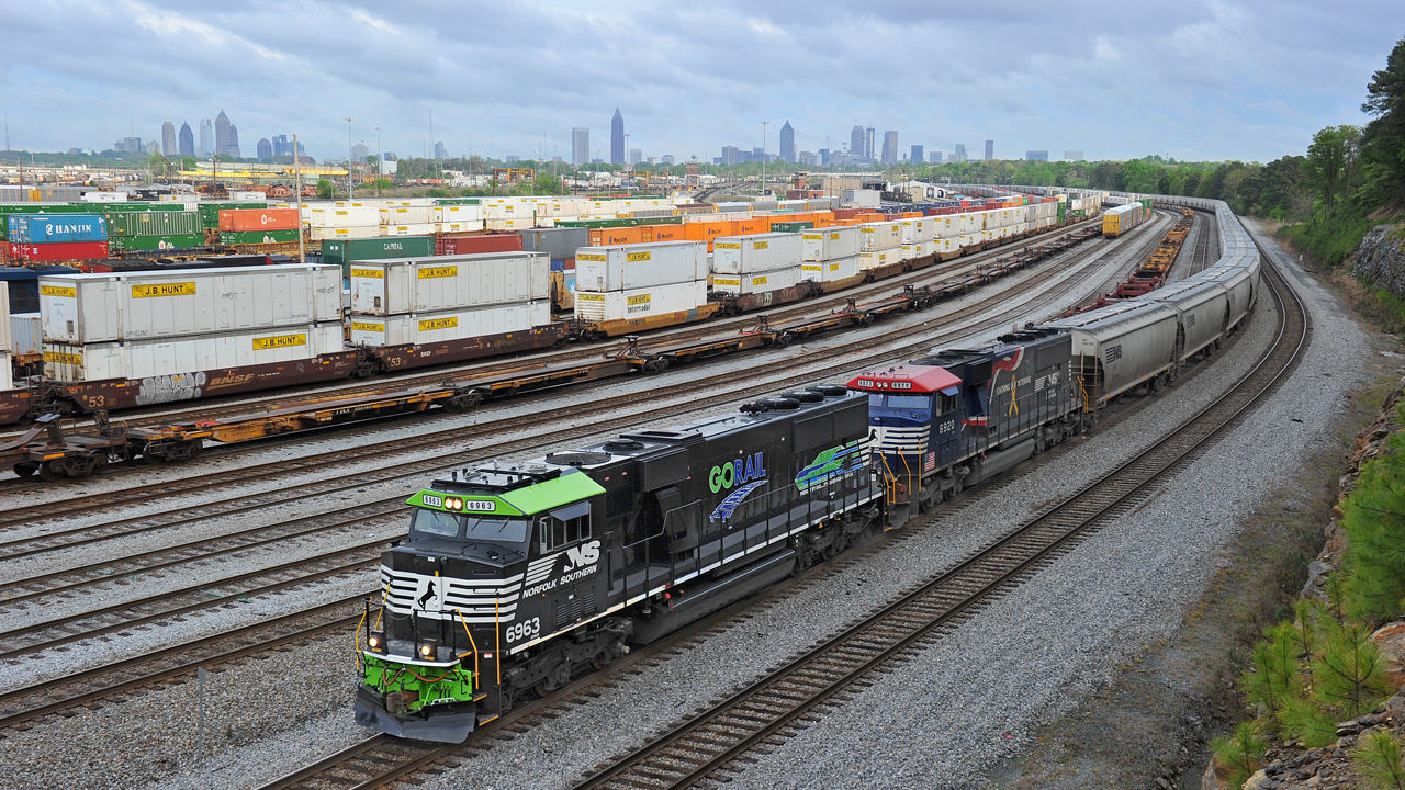 Norfolk Southern GoRail and vintage locomotives pulling covered hoppers – Inman Yard;  Atlanta, Ga.  (text and photograph courtesy of Norfolk Southern)