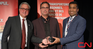 Pictured: CN’s Senior Director Operational Technology Luc Fiset and Chief, Technology and Supply Chain Rahim Karmali accepting the RAC 2022 Safety Award from RAC President and CEO Marc Brazeau. (Photograph Courtesy of CN, via Twitter)