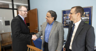 Pictured from left: Mark Gruber, Head of Urban Rail Development Center, Alstom, Americas, with Sanjeev G. Shroff, interim U.S. Steel Dean of Engineering, University of Pittsburgh, and David Trayhan, Vice President, Automated People Movers, Alstom, Americas, at the MOU signing in Benedum Hall. (Caption and Photograph Courtesy of Alstom and University of Pittsburgh)