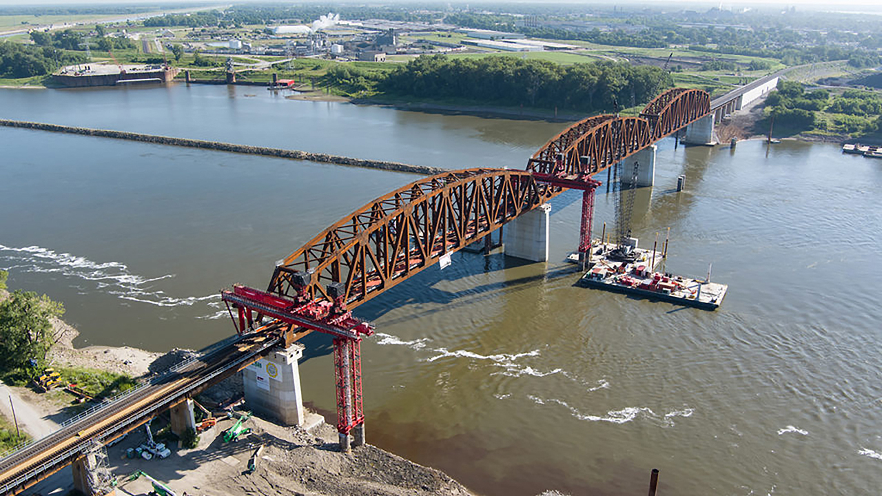 The 133-year-old Merchants Bridge, which spans the Mississippi River at St. Louis and links Missouri and Illinois, officially reopened to rail traffic Sept. 15, following completion of a $222 million replacement project. Owned and operated by the Terminal Railroad Association (TRRA), the bridge serves six Class I railroads and Amtrak. (Courtesy Walsh Construction and Trey Cambern Photography)