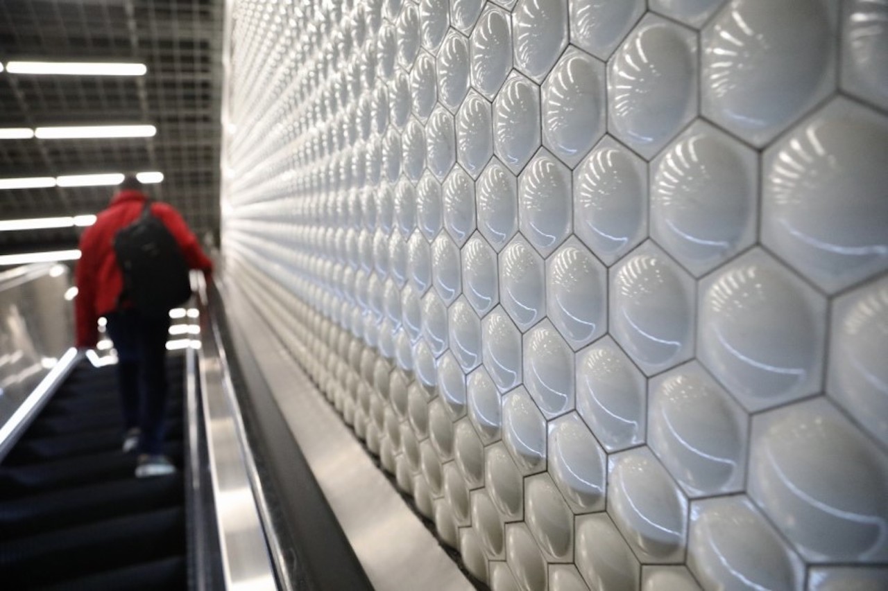 BART's bubble tiles are seen on a wall at Powell St. Station.