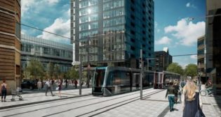 An artist's impression of LRVs on the light rail line through a busy street in Quebec City. Photo Credit: Ville de Quebec