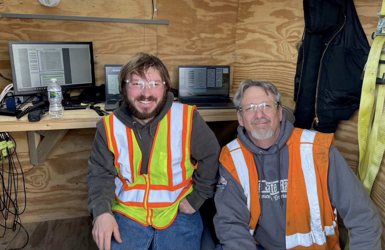 Michigan Technological University's Zach Stanchina (left) and Lake State Railway's Roger Fuehring work to collect data on locomotive emissions for a study conducted through a partnership with ASLRRA, Michigan Tech, Lake State Railway and Chicago South Shore & South Bend Railroad. The study is funded by a Federal Railroad Administration grant.