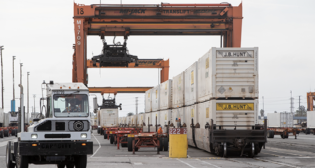 At our intermodal hubs, where containers and trailers arrive or depart by train or truck and are transferred between modes, we’ll soon expand our testing of AI to enable hostler drivers to move the units more efficiently from parking lots to tracks or from tracks to parking lots. (Caption and Photograph Courtesy of BNSF)