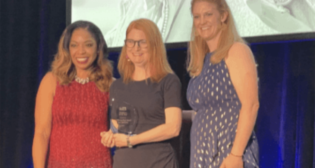 CHSRA Deputy Director Beverly Kenworthy (center) accepts the Employer of the Year award from WTS International. (Photograph Courtesy of CHSRA)