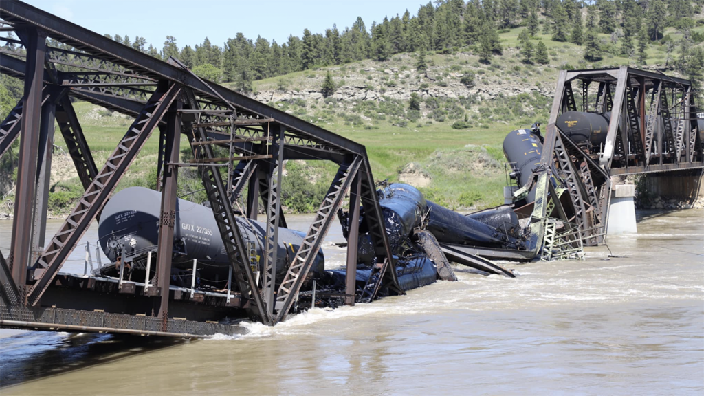 A bridge over the Yellowstone River near Columbus, Mont., collapsed June 24. A Montana Rail Link train crossing it was sent into the water below. (Photograph Courtesy of Sen. Steve Daines, R-Mont., via Facebook)