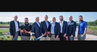 Watco SVP of Sales for Terminals and Port Services Marc Massoglia (fourth from left) on April 11 attended with other stakeholders the ribbon-cutting ceremony for Port 10 Watco Rail Logistics’s new SIT yard in Texas. (Watco Photograph)