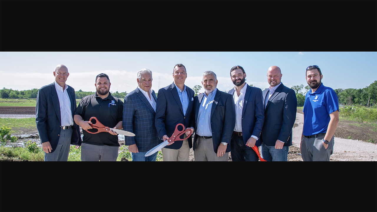 Watco SVP of Sales for Terminals and Port Services Marc Massoglia (fourth from left) on April 11 attended with other stakeholders the ribbon-cutting ceremony for Port 10 Watco Rail Logistics’s new SIT yard in Texas. (Watco Photograph)
