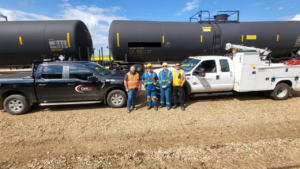 Pictured are Cando Superintendent Chris Greenaway and Assistant Superintendent Colin Love with Caltrax employees Damen Duczek, MRU Lead, and Kevin Gage, Vac Truck Operator and MRU Technician in the field, at Cando Sturgeon Terminal. (Caption and Photograph Courtesy of Cando Rail and Caltrax)