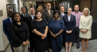 ​​NTSB Chair Jennifer Homendy (right) with some of the 15 new employees sworn in on Sept. 25. The agency now has 433 staffers. (Caption and Photograph Courtesy of NTSB)