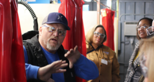 PCC Welding instructor Todd Barnett on Nov. 10, 2022, discussed the amenities of the mobile training center with Union Pacific. (Caption and Photograph Courtesy of PCC)