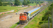 A CN train is viewed passing the Milton Intermodal Terminal construction site in July 2023 as crews work to extend the "CN Ash" control point in preparation for the Terminal. The train pictured is CN delivering a new Siemens Venture trainset to VIA Rail in Montreal. (Caption and Photograph Courtesy of Stephen C. Host)