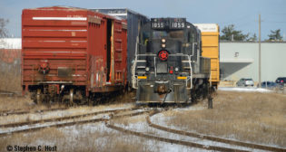 GIO Railway's final train to St. Catharines, Ontario, shuffling boxcar loads of pulp from the USA as the crew prepares to spot the customer for the final time on Feb. 29. (Stephen C. Host)