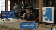 Premier of Alberta Danielle Smith announces the government's master plan aimed at increasing passenger rail service in the province. (Screenshot Courtesy of the Alberta government via YouTube)