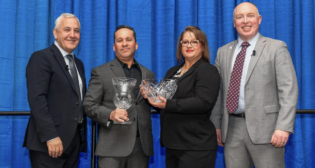 The Union Pacific 2023 J.C. Kenefick Safety Award winner Bayson Oxuzidis with, from left, Chief Executive Officer Jim Vena; Bayson’s wife, Jennifer; and Eric Gehringer, Executive Vice President-Operations. (UP Photograph)