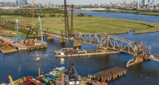 The Portal North Bridge crossing the Hackensack River in the New Jersey Meadowlands is 50% complete, NJT and Amtrak reported May 13. (Photo Credit: Amtrak/Marc Glucksman and William Kyle Anderson)