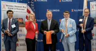The May 29 ribbon-cutting ceremony for the National University Rail Center of Excellence was attended by federal and state dignitaries, including FRA Administrator Amit Bose, Sen. Dick Durbin (D-Ill.), Rep. Nikki Budzinski (D-Ill.), Illinois Department of Transportation Secretary Omer Osman, and university officials, including UIUC professor and National University Rail Center of Excellence Director Chris Barkan. (Photo Credit: Heather Coit)